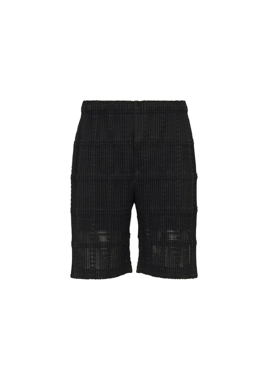 A product shot of the HOMME PLISSÉ ISSEY MIYAKE LACE GRID PLEATS pants in black.