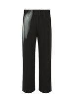 A detail shot of the HOMME PLISSÉ ISSEY MIYAKE IN THE SHADOW trousers.