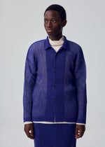 A model wears the HOMME PLISSÉ ISSEY MIYAKE RUSTIC MESH rustic-mesh-shirt-blue-2.