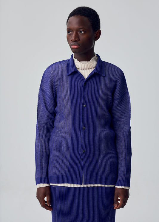 A model wears the HOMME PLISSÉ ISSEY MIYAKE RUSTIC MESH rustic-mesh-shirt-black.