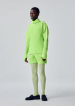 A model wears the HOMME PLISSÉ ISSEY MIYAKE COLOR PLEATS 1 color-pleats-1-t-shirt-darkside-brown.
