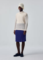 A model wears the HOMME PLISSÉ ISSEY MIYAKE RUSTIC MESH rustic-mesh-t-shirt-black-3.