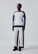 A model wears the HOMME PLISSÉ ISSEY MIYAKE FRAMEWORK : CHUSEN framework-chusen-t-shirt-white.