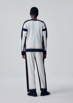 A model wears the HOMME PLISSÉ ISSEY MIYAKE FRAMEWORK : CHUSEN shirt.