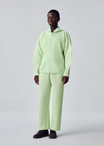 A model wears the HOMME PLISSÉ ISSEY MIYAKE MONTHLY COLORS : JULY monthly-colors-july-blouson-shade-greyish-brown-1.