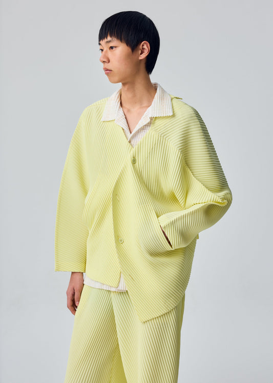 A model wears the HOMME PLISSÉ ISSEY MIYAKE SLASH blouson.