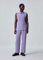 A model wears the HOMME PLISSÉ ISSEY MIYAKE MONTHLY COLORS : JULY monthly-colors-july-polo-shirt-black.