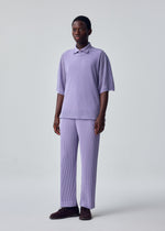 A model wears the HOMME PLISSÉ ISSEY MIYAKE WASHI FRAMEWORK-T washi-framework-t-t-shirt-beige-1.