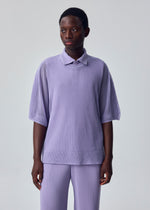 A model wears the HOMME PLISSÉ ISSEY MIYAKE WASHI FRAMEWORK-T washi-framework-t-t-shirt-lavender-3.