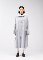A model wears the 132 5. Issey Miyake FLAT WIND COAT coat.