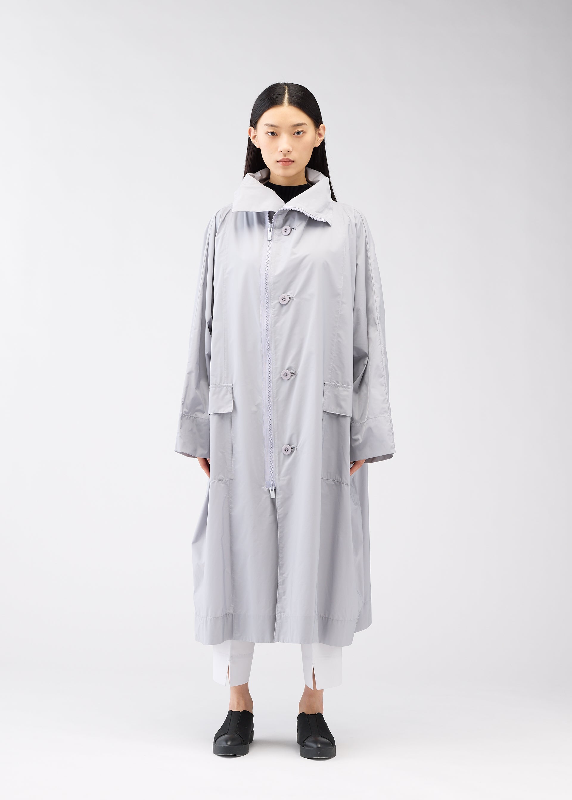 A model wears the 132 5. Issey Miyake FLAT WIND COAT coat.