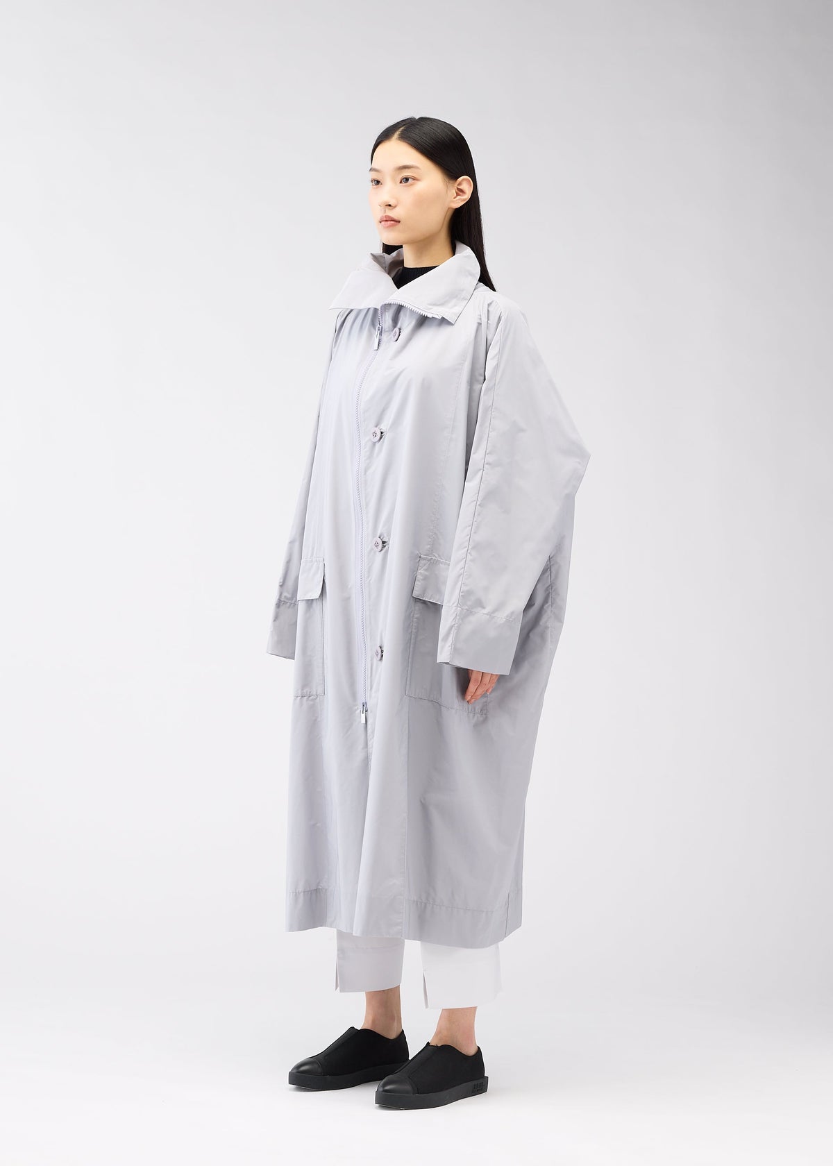 A model wears the 132 5. Issey Miyake FLAT WIND COAT coat.