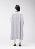 A model wears the 132 5. Issey Miyake FLAT WIND COAT coat.