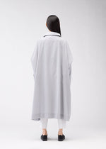 A model wears the 132 5. Issey Miyake FLAT WIND COAT coat.