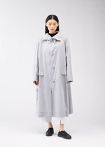 A model wears the 132 5. Issey Miyake FLAT WIND COAT coat.