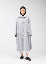 A model wears the 132 5. Issey Miyake FLAT WIND COAT coat.