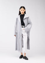 A model wears the 132 5. Issey Miyake FLAT WIND COAT coat.