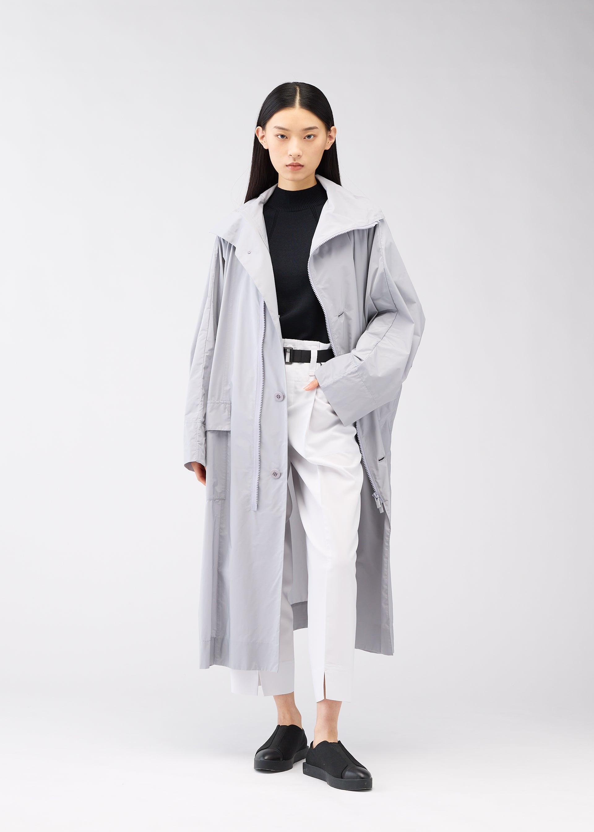 A model wears the 132 5. Issey Miyake FLAT WIND COAT coat.
