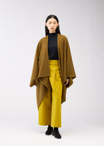 A model wears the 132 5. ISSEY MIYAKE DRAPE COAT coat.