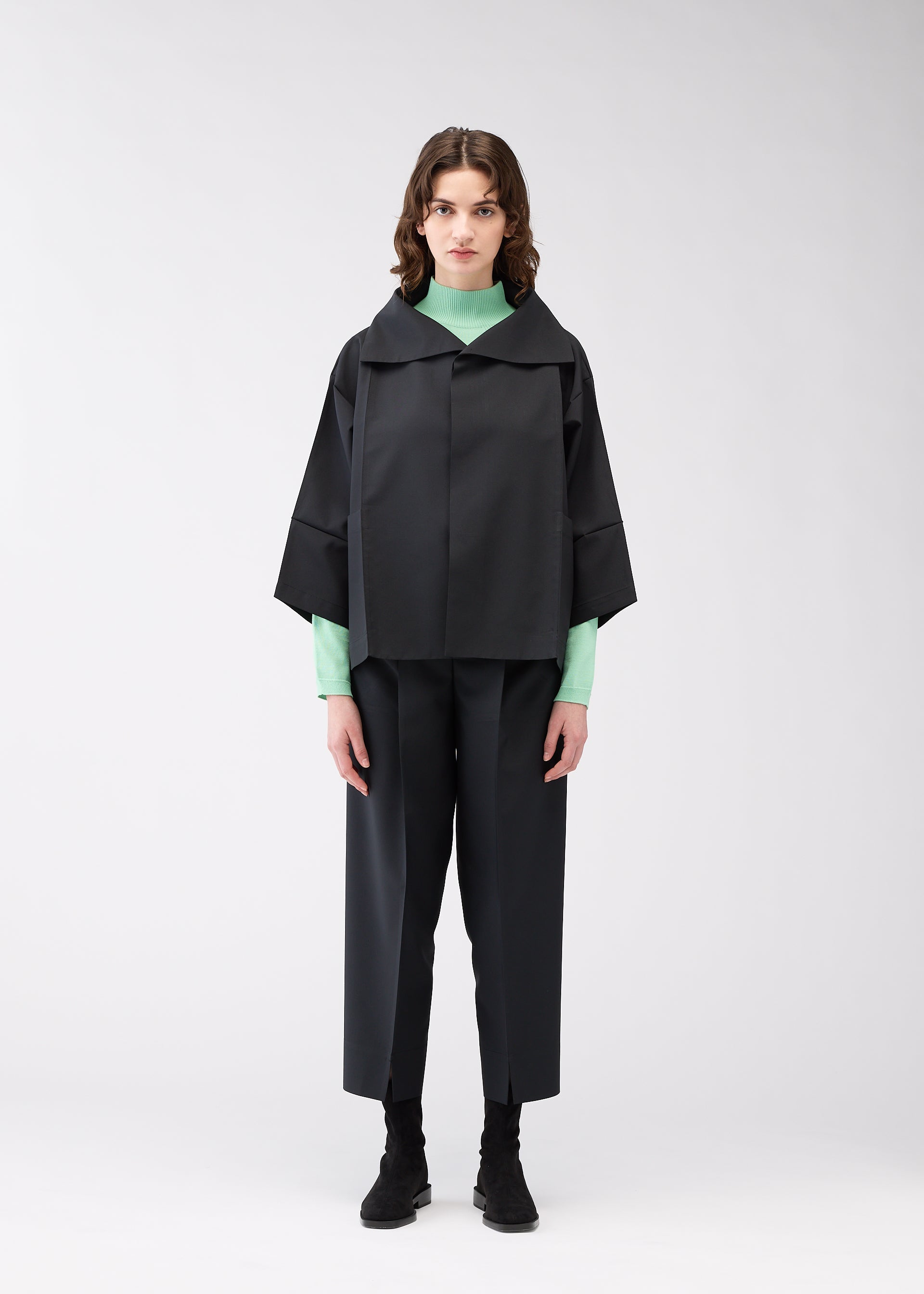 A model wears the 132 5. Issey Miyake 132 5. FLAT 1 jacket.