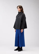 A model wears the 132 5. Issey Miyake 132 5. FLAT 2 jacket.