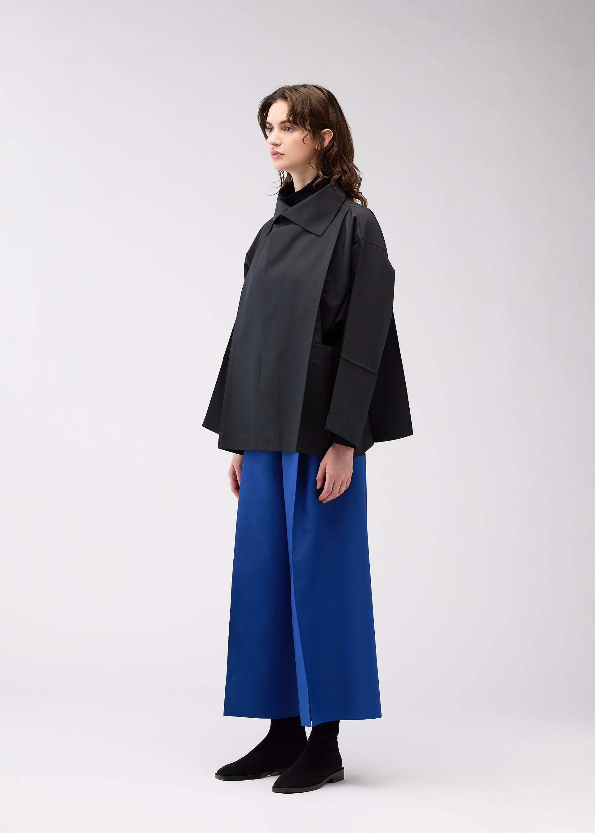 A model wears the 132 5. Issey Miyake 132 5. FLAT 2 jacket.