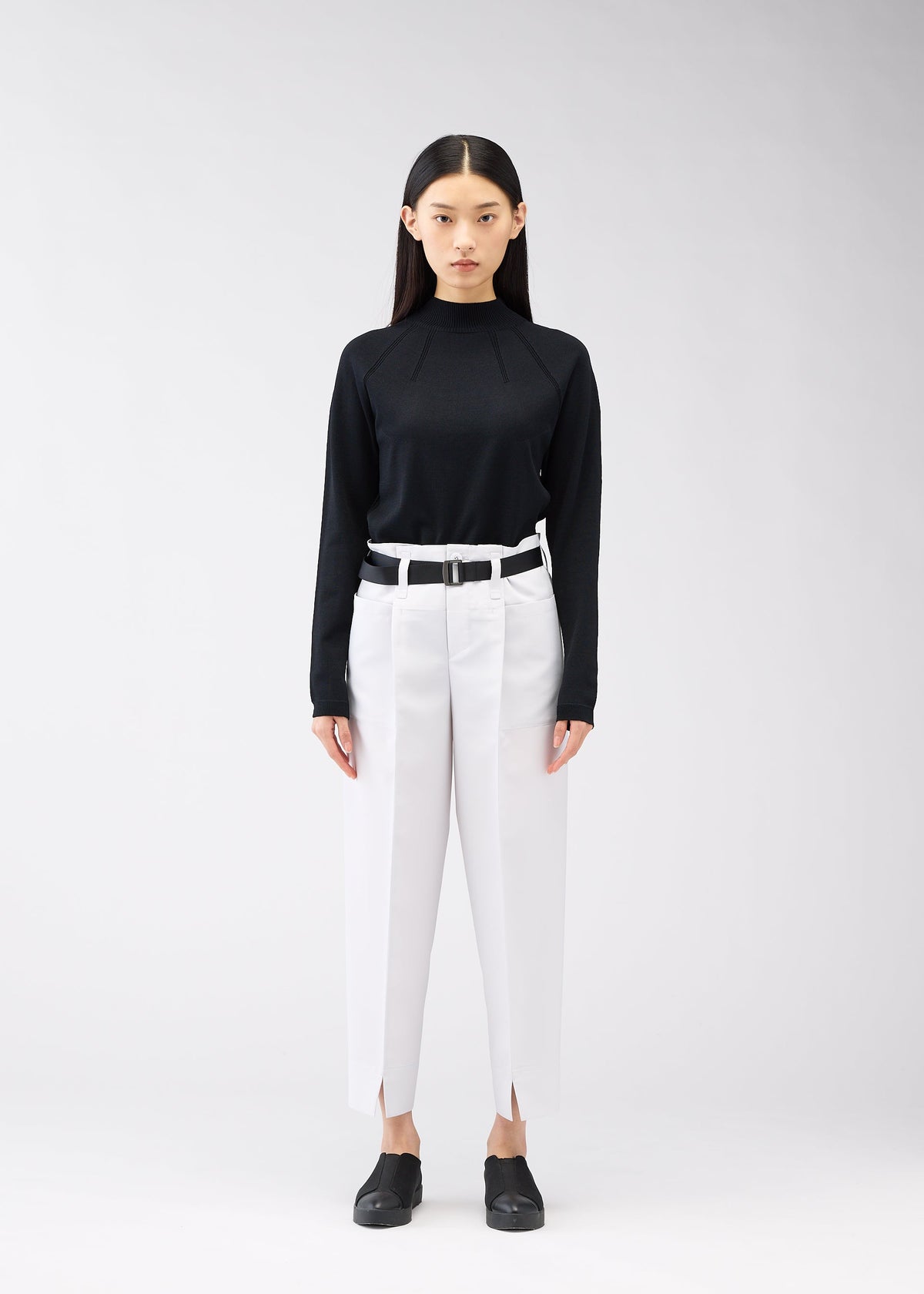 A model wears the 132 5. Issey Miyake 132 5. FLAT 1 trousers.