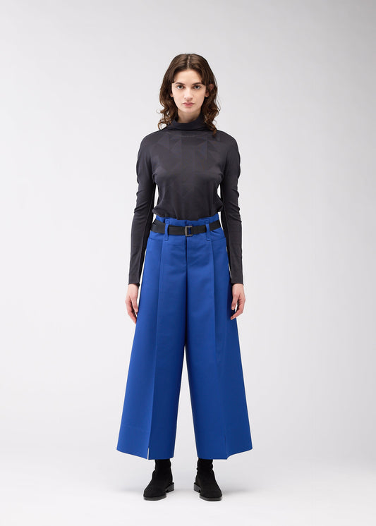 A model wears the 132 5. Issey Miyake 132 5. FLAT 2 trousers.