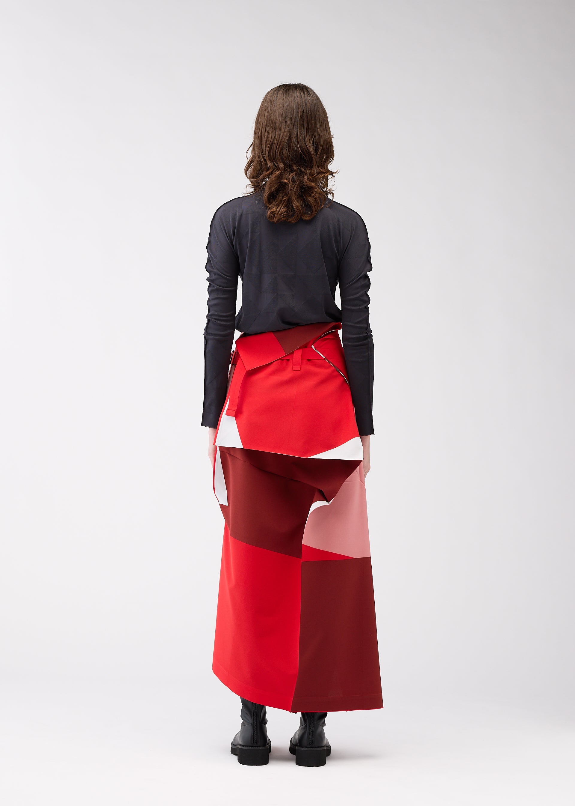 A model wears the 132 5. ISSEY MIYAKE POSITIONS skirt.