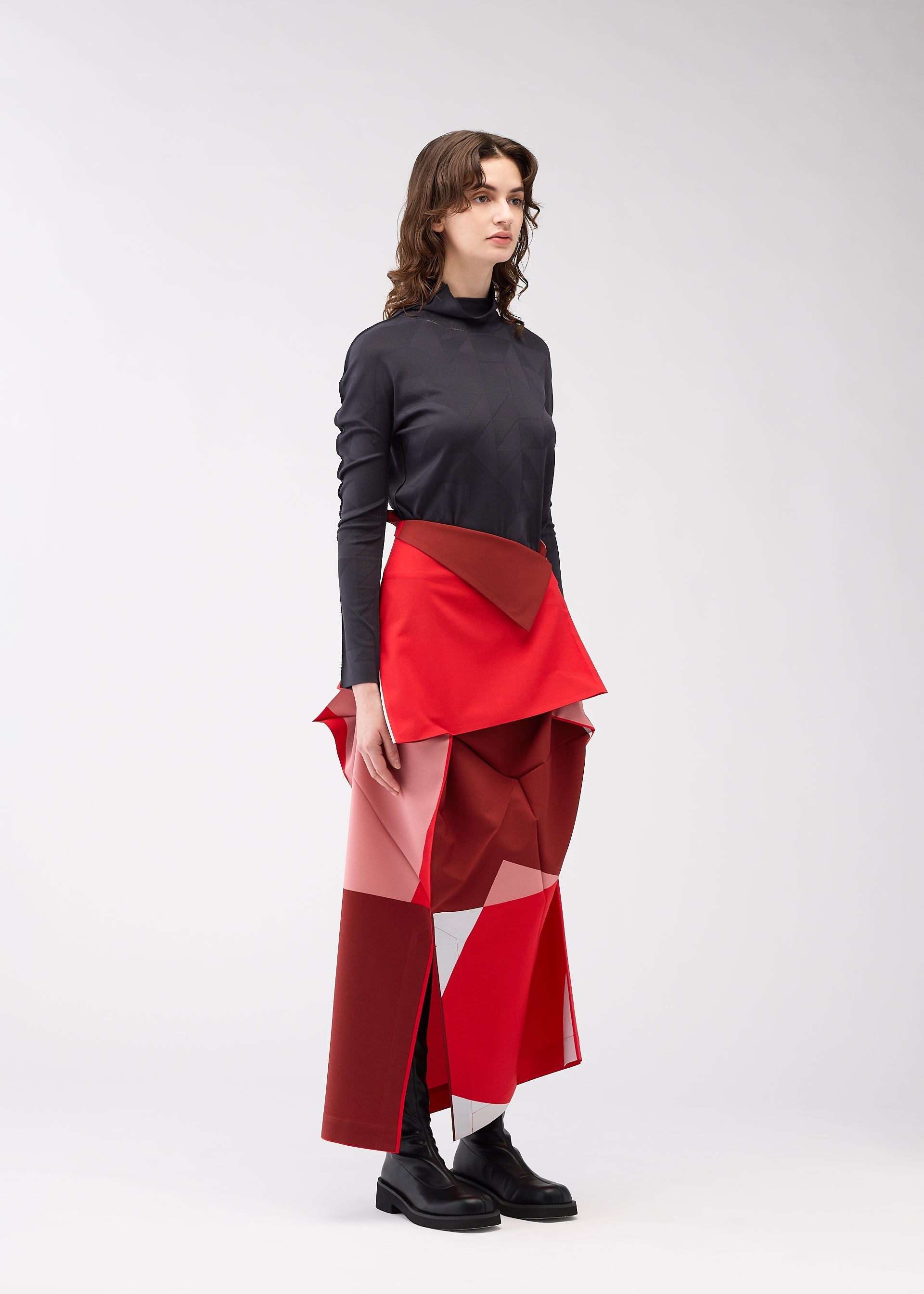 A model wears the 132 5. Issey Miyake POSITIONS skirt.