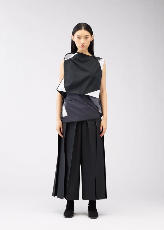 A model wears the 132 5. ISSEY MIYAKE POSITIONS shirt.