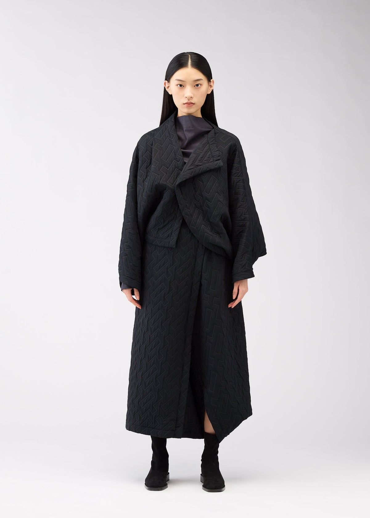 A model wears the 132 5. Issey Miyake ONE CLOTH PUFF cardigan.