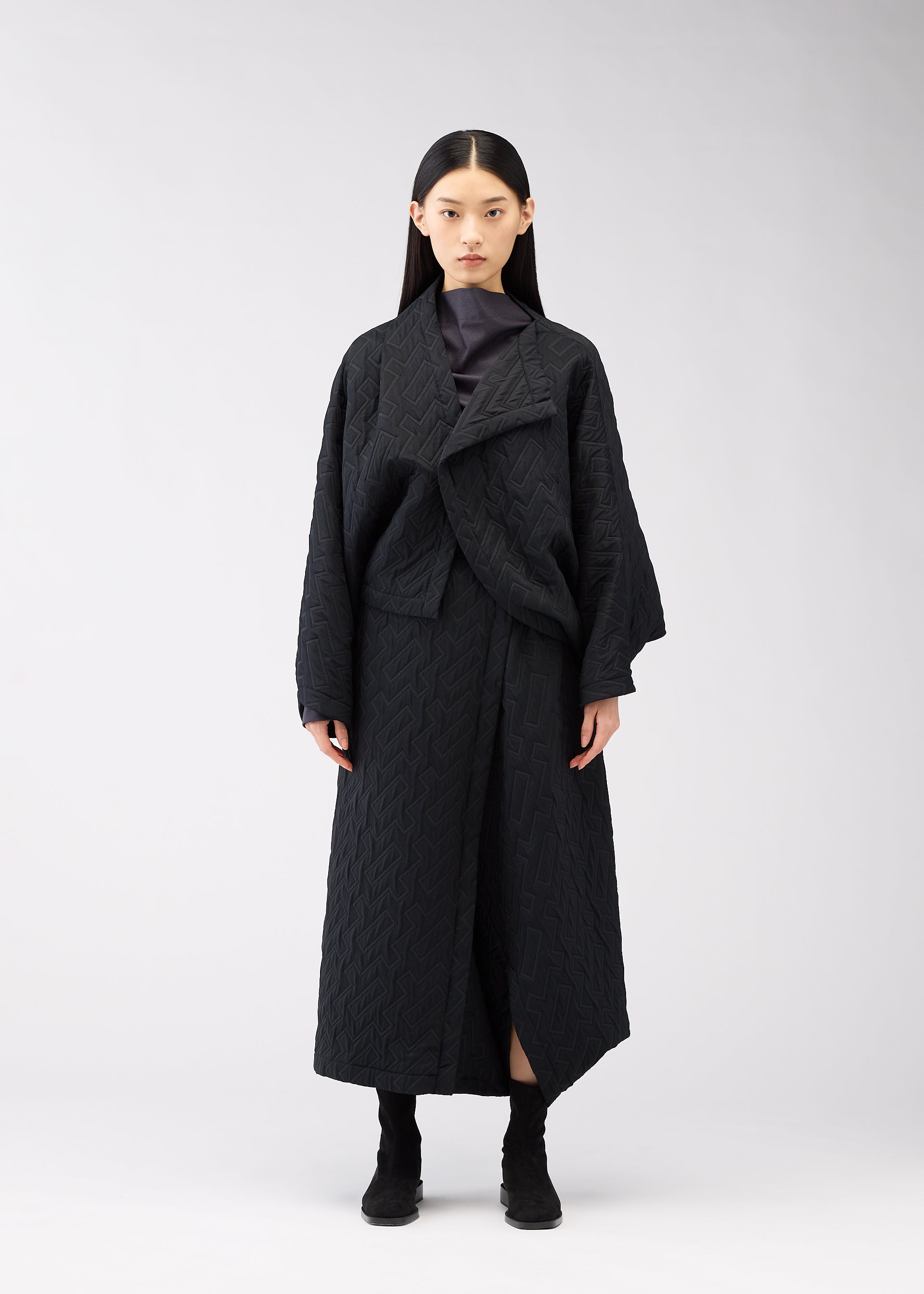A model wears the 132 5. Issey Miyake ONE CLOTH PUFF cardigan.