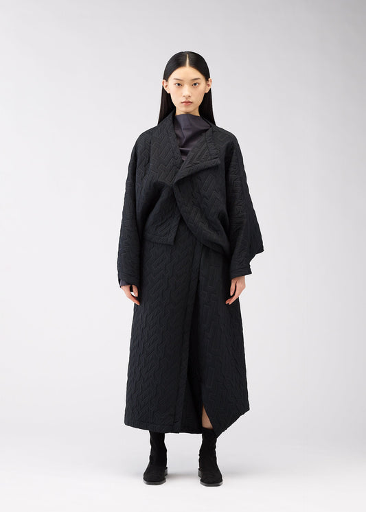 A model wears the 132 5. Issey Miyake ONE CLOTH PUFF cardigan.