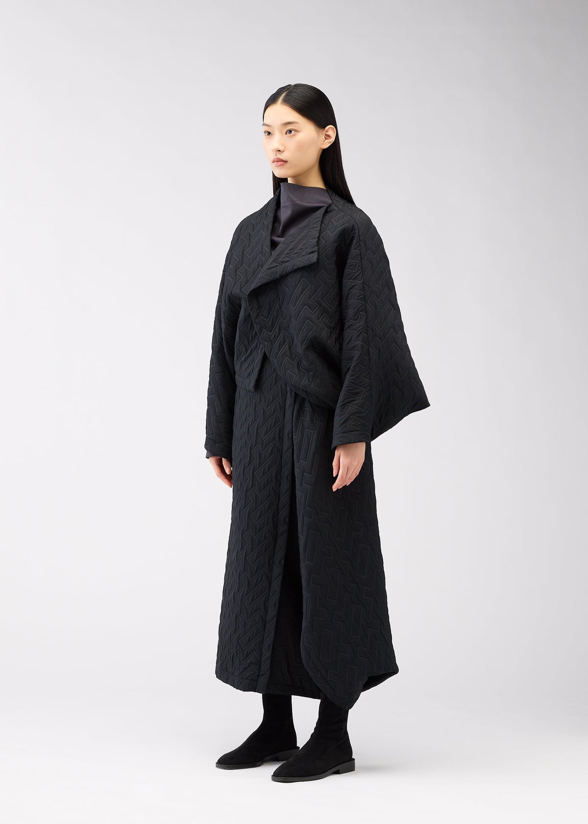 A model wears the 132 5. Issey Miyake ONE CLOTH PUFF cardigan.