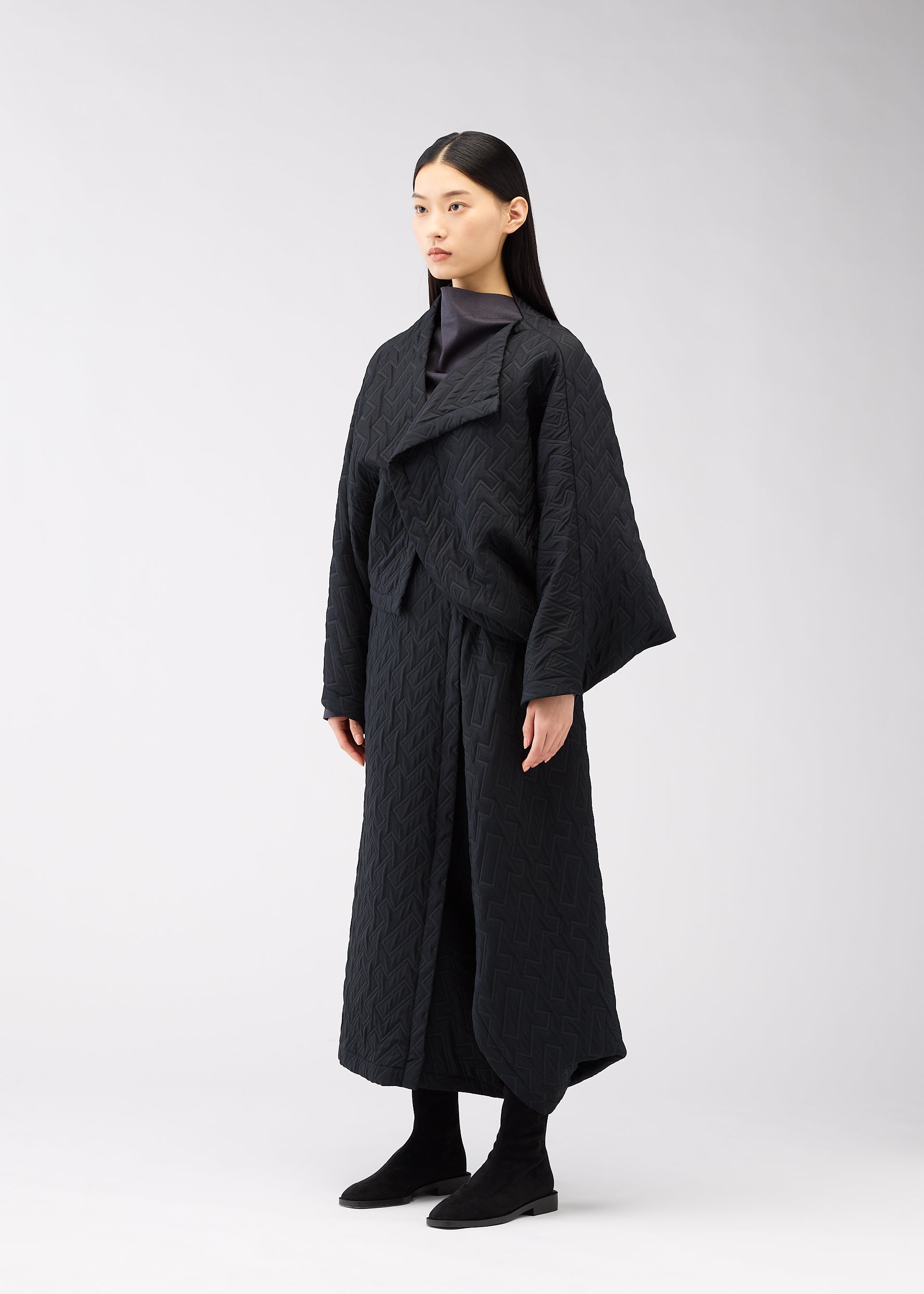 A model wears the 132 5. Issey Miyake ONE CLOTH PUFF cardigan.