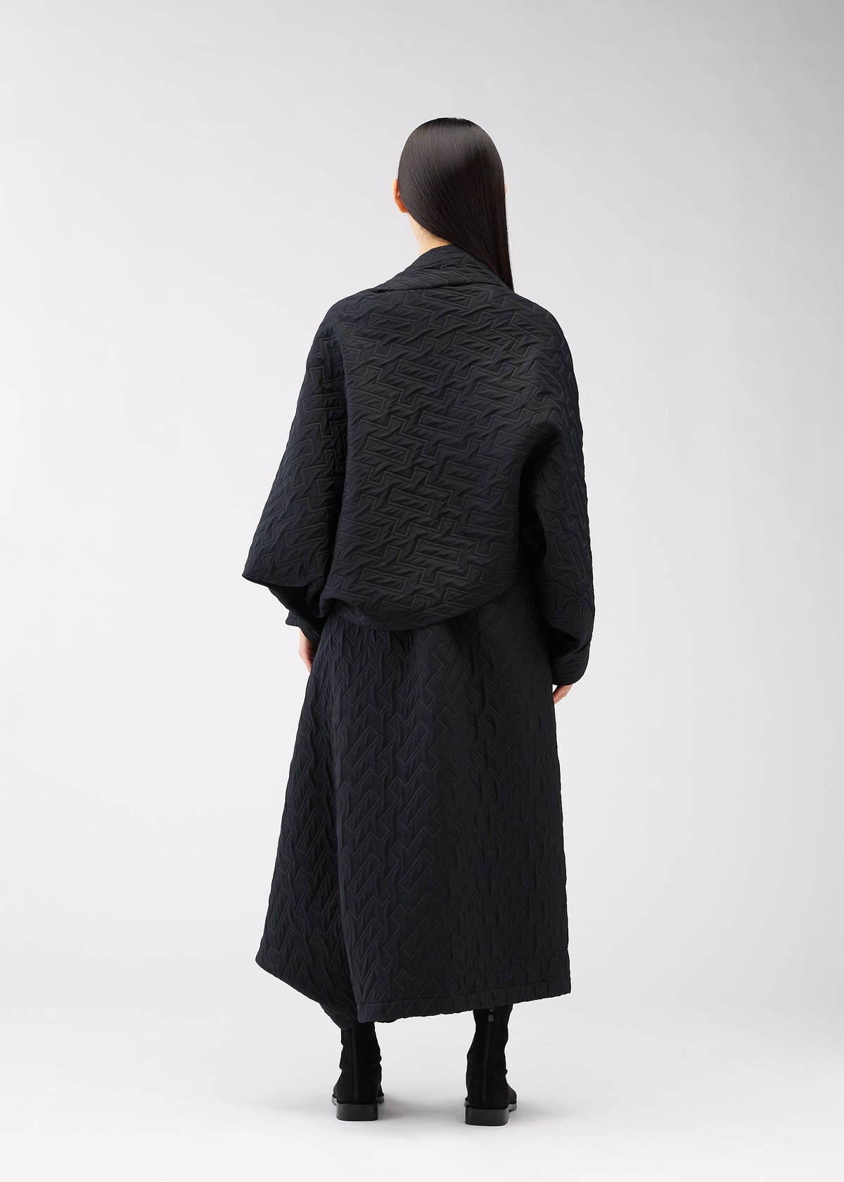 A model wears the 132 5. Issey Miyake ONE CLOTH PUFF cardigan.