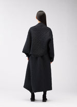 A model wears the 132 5. Issey Miyake ONE CLOTH PUFF cardigan.