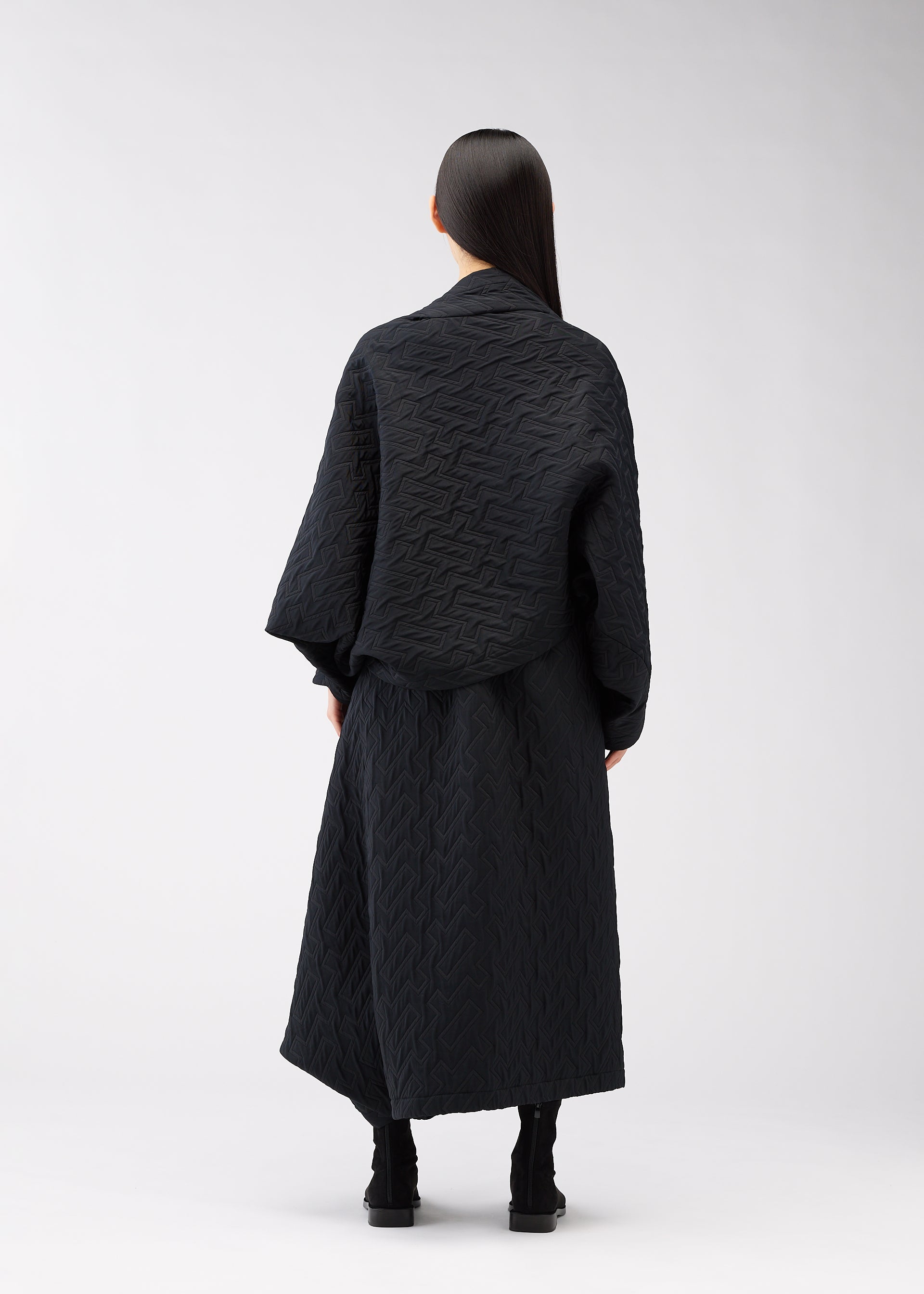 A model wears the 132 5. Issey Miyake ONE CLOTH PUFF cardigan.