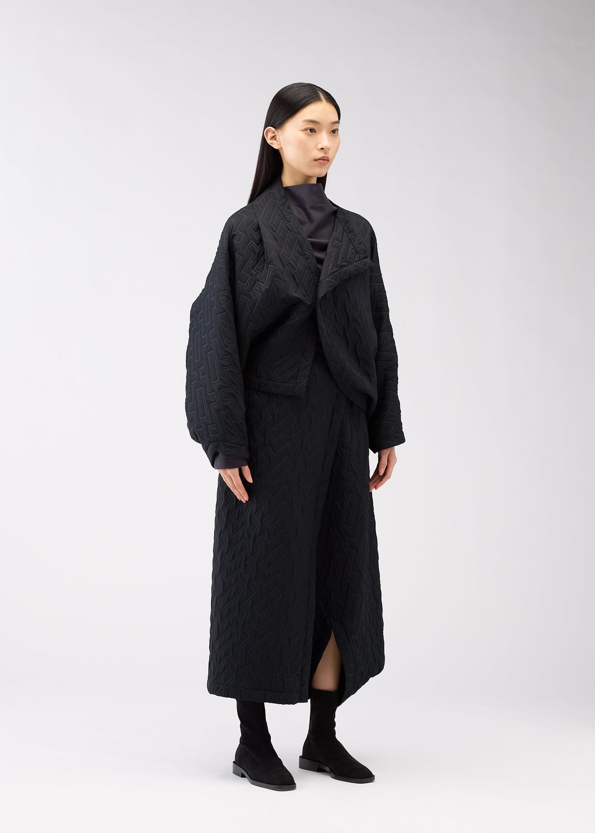 A model wears the 132 5. Issey Miyake ONE CLOTH PUFF cardigan.
