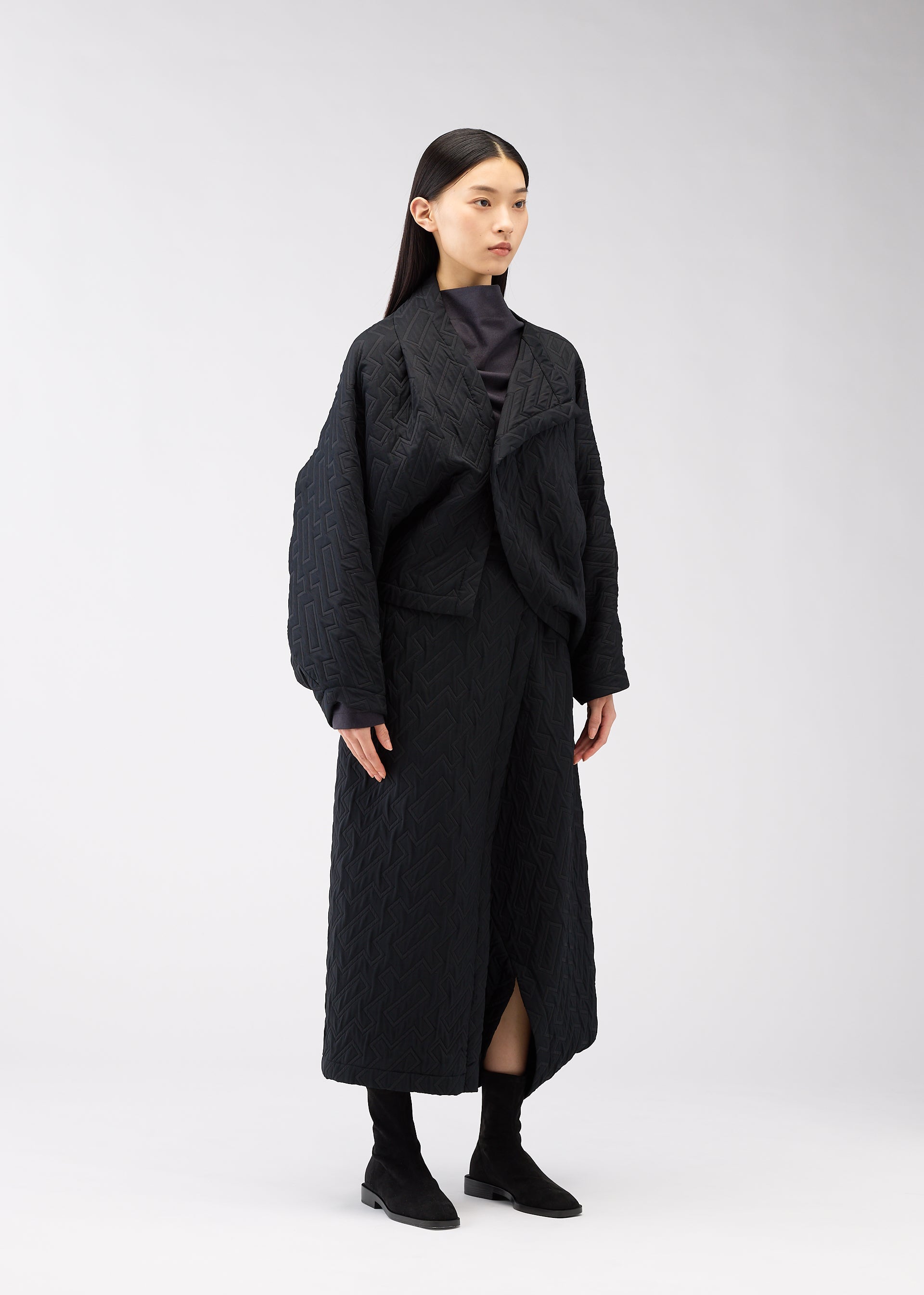 A model wears the 132 5. Issey Miyake ONE CLOTH PUFF cardigan.