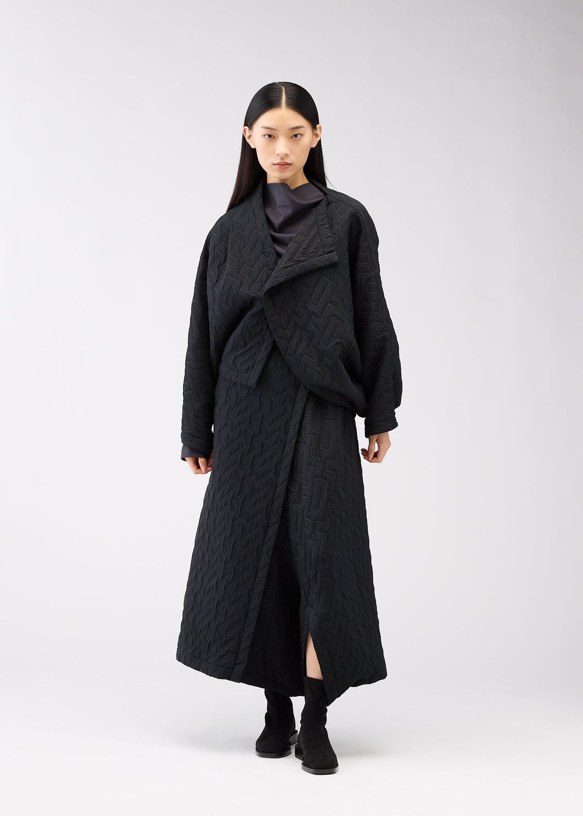 A model wears the 132 5. Issey Miyake ONE CLOTH PUFF cardigan.