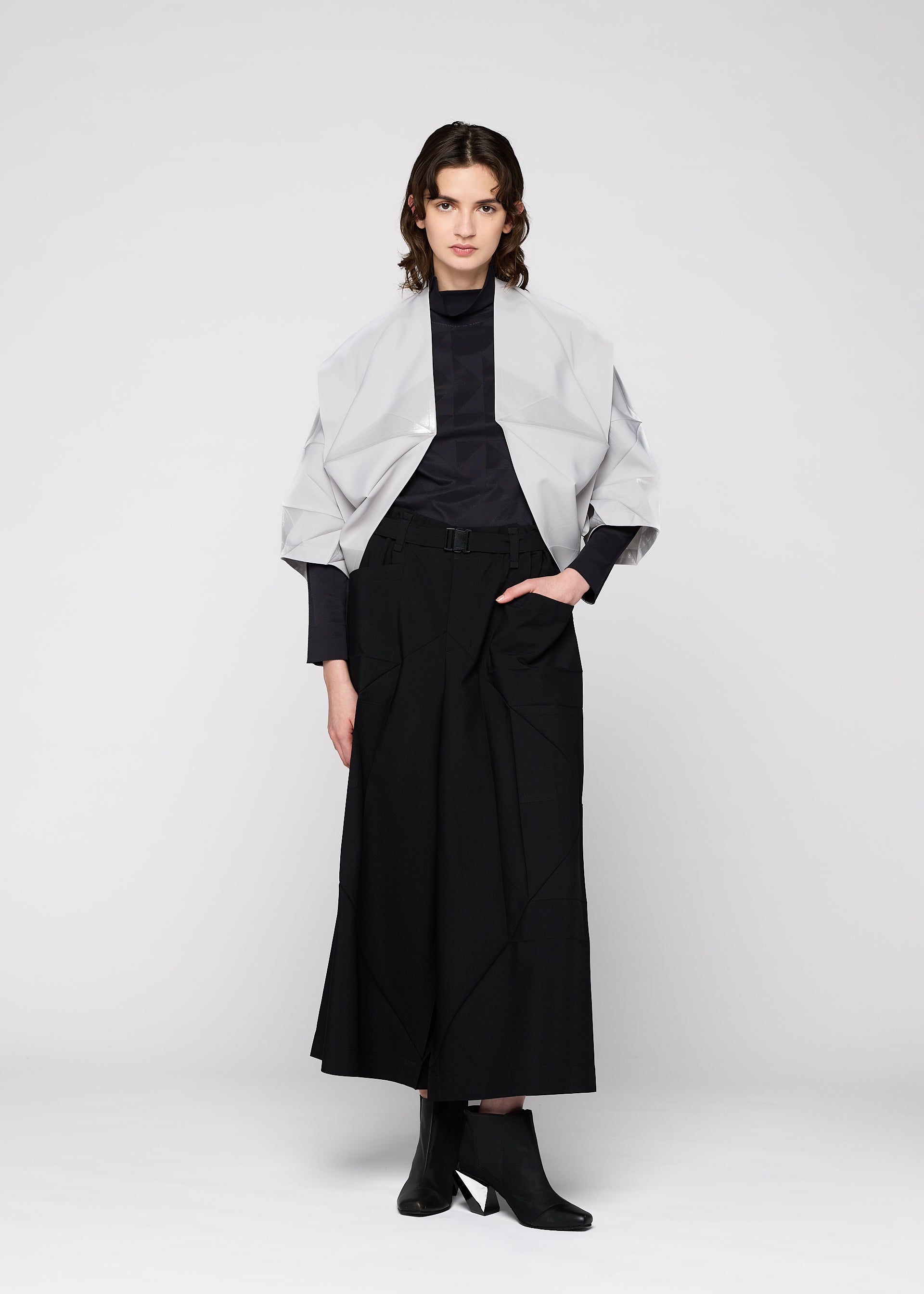 A model wears the 132 5. Issey Miyake NO.16 FOIL cardigan.