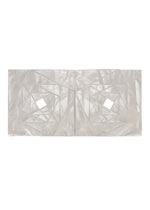 A detail shot of the 132 5. Issey Miyake NO.16 FOIL cardigan.