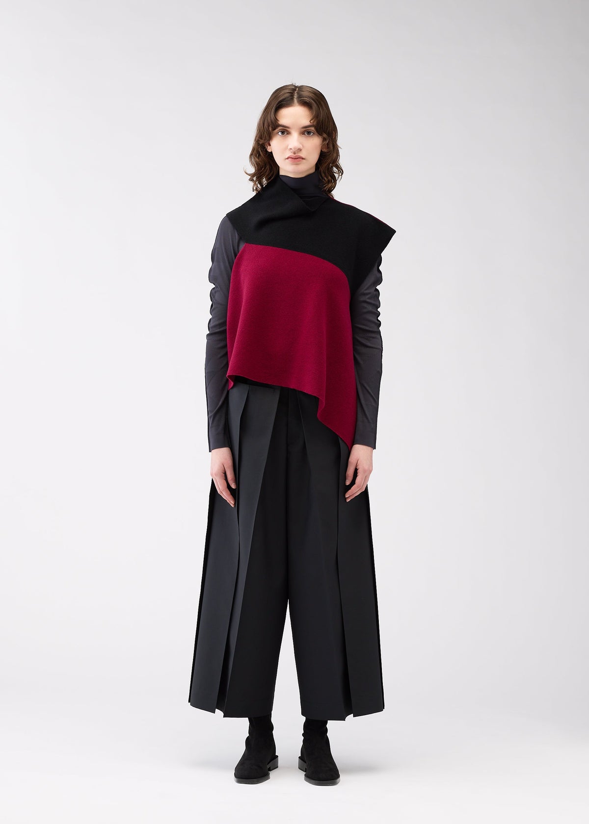 A model wears the 132 5. Issey Miyake POSITIONED KNIT top.