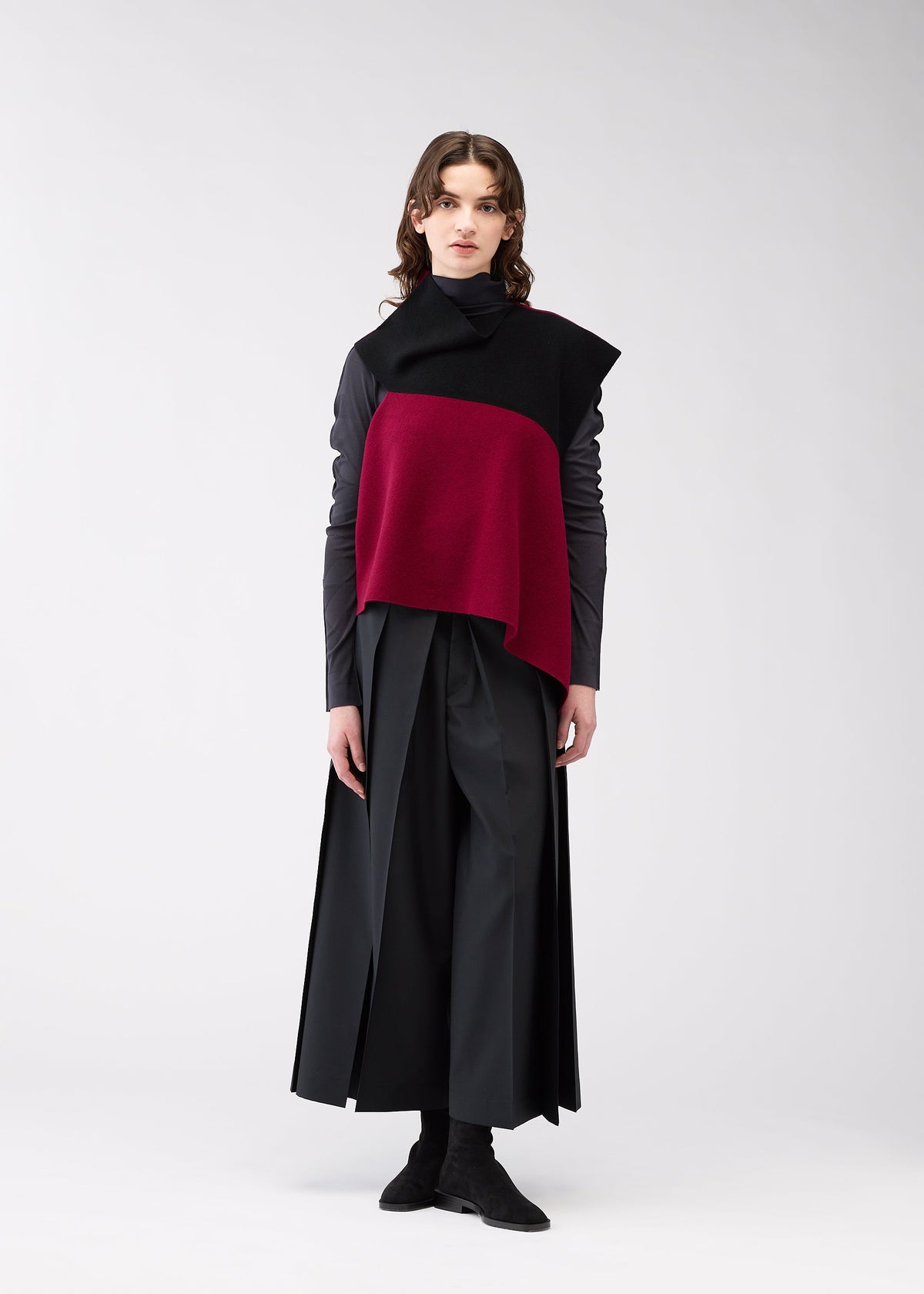 A model wears the 132 5. Issey Miyake POSITIONED KNIT top.