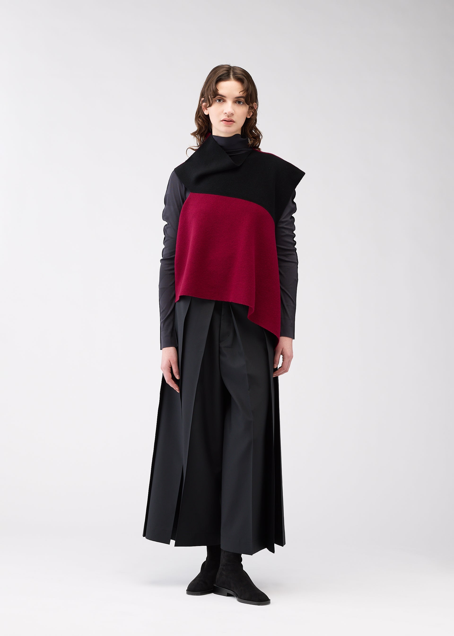 A model wears the 132 5. Issey Miyake POSITIONED KNIT top.