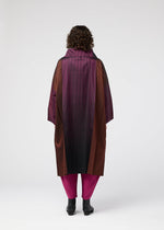 A model wears the 132 5 ISSEY MIYAKE GRADATION COAT prêt à porter.
