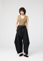 A model wears the 132 5. Issey Miyake FACET SOLID pants.