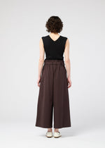 A model wears the 132 5. Issey Miyake WASHI STRETCH pants.